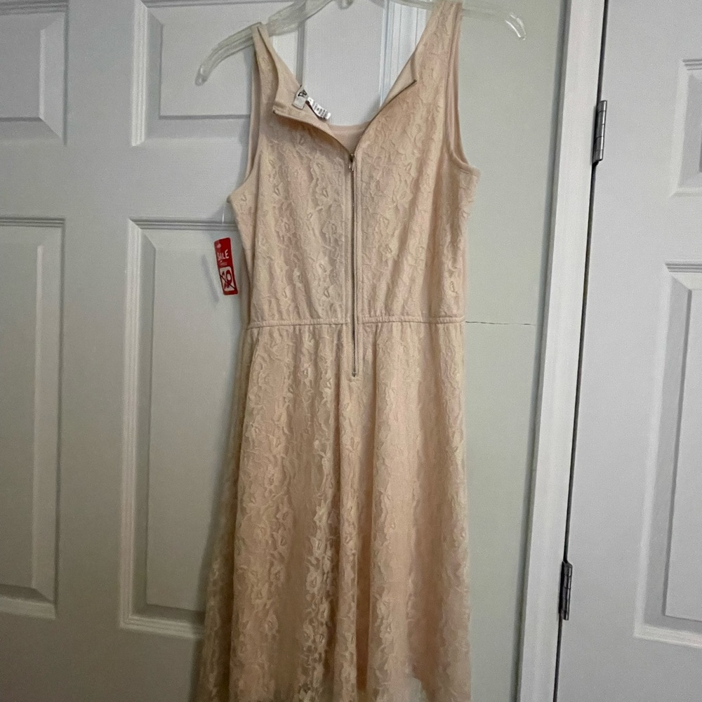 Brand new dress. Full lace on back with zipper and bottom part lace on front.